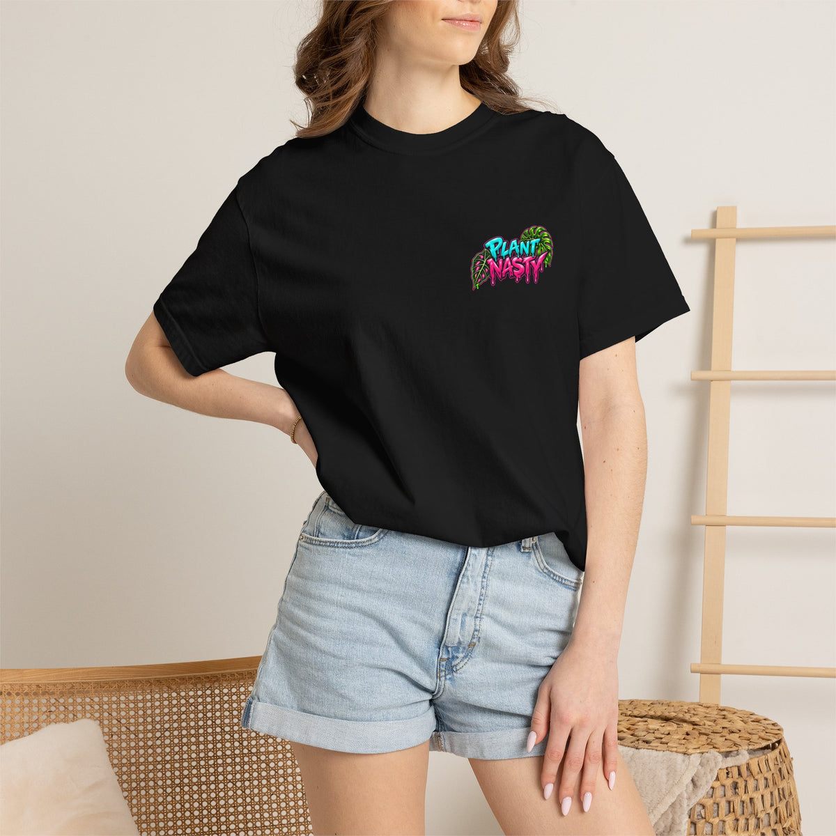 Black Get Nasty. Buy Plants.™ Signature T-shirt by Printify featuring a Plant Nasty logo graphic on the front.